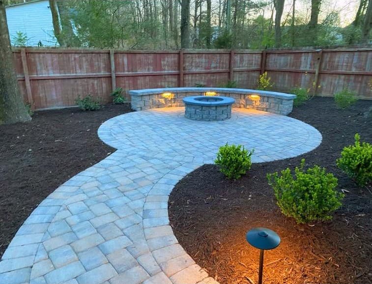 Circular paver patio with fire pit & landscape lighting