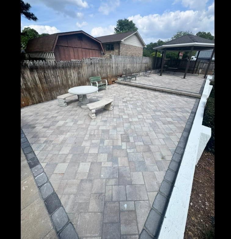 Paver patio with gazebo, benches, and seating area